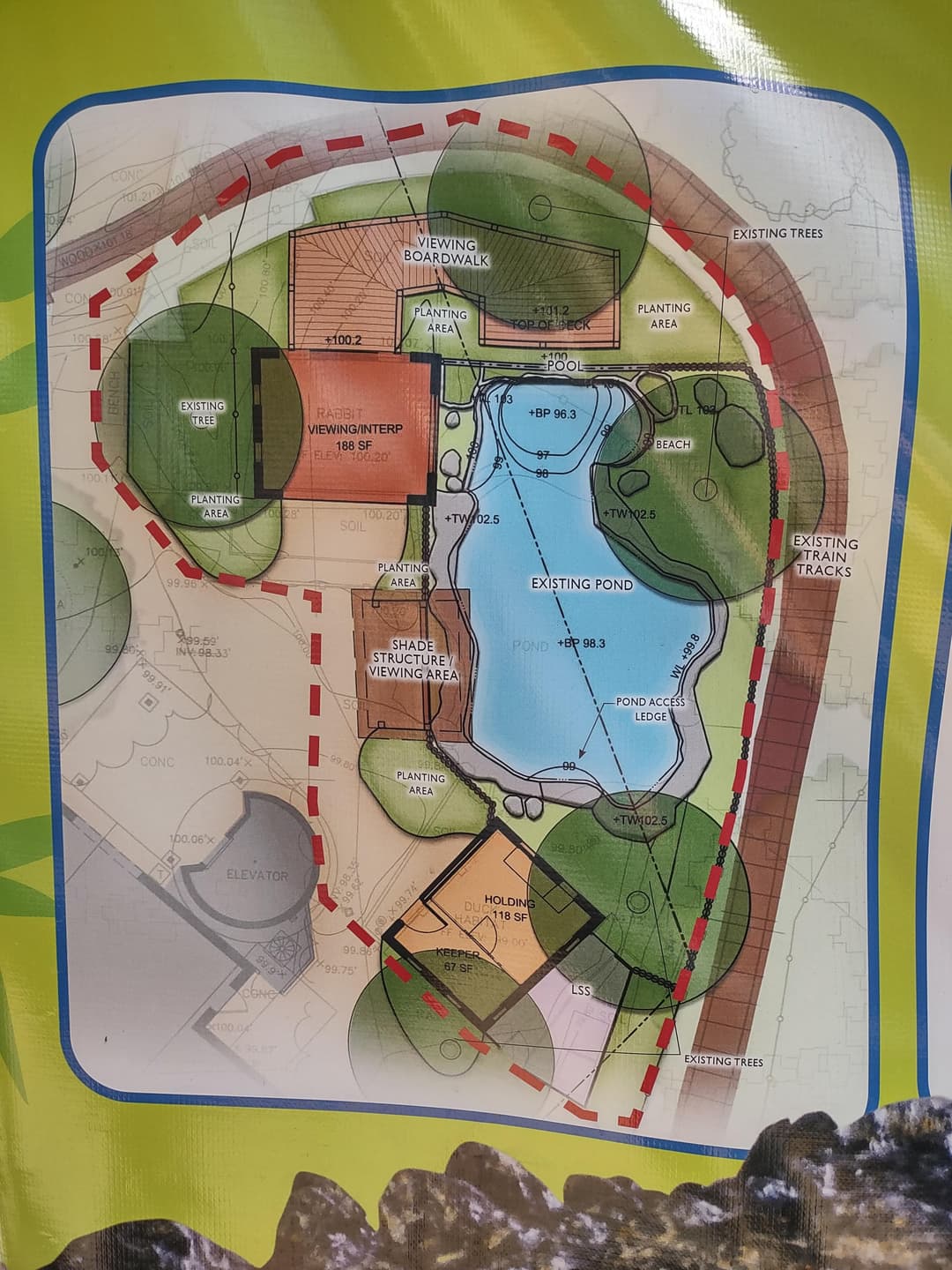 Landscape design plan featuring a pond, pathways, and green spaces for recreation and nature.